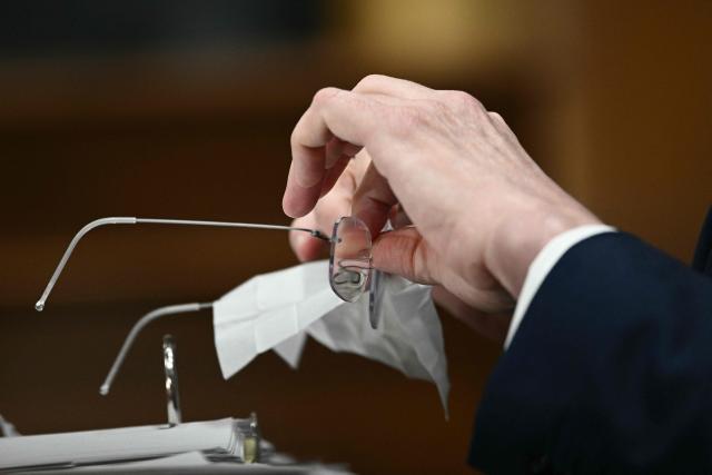 US Secretary of Treasury Scott Bessent cleans his glasses as he testifies during a Senate Finance Committee hearing concerning the fiscal year 2027 budget for the Treasury Department, on Capitol Hill in Washington, DC, on June 3, 2026. (Photo by Brendan SMIALOWSKI / AFP)