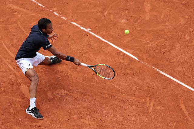Canada's Felix Auger-Aliassime plays a forehand return to Italy's Flavio Cobolli during their men's quarter final singles match on day 11 of the French Open tennis tournament on Court Philippe-Chatrier at the Roland-Garros Complex in Paris on June 3, 2026. (Photo by Thomas SAMSON / AFP)
