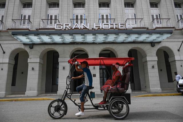 A tricycle passes in front of the Gran Hotel Bristol in Havana on June 3, 2026. The Spanish hotel group Melia has stopped managing 15 hotels in Cuba that it operated in partnership with the Gaesa conglomerate, which is linked to the army and subject to United States sanctions (Photo by YAMIL LAGE / AFP)
