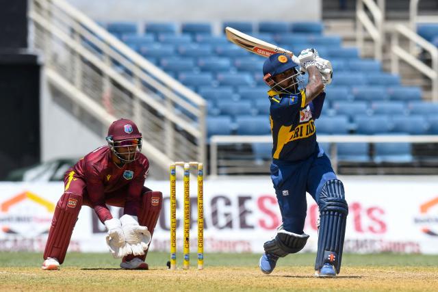Kusal Mendis of Sri Lanka hits 6 and Shai Hope (L) of West Indies watch during the 1st One Day International (ODI) cricket match between West Indies and Sri Lanka at Sabina Park in Kingston, Jamaica, on June 3, 2026. (Photo by Randy Brooks / AFP)