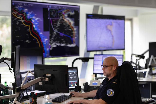 A shift supervisor monitors screens at the Cross-A (Regional operational monitoring and rescue center- A for Atlantic) in Etel, western France on June 3, 2026. In France, the CROSS units are responsible for search and rescue operations at sea. (Photo by Fred TANNEAU / AFP)