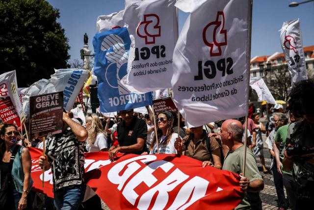 People take part in a demonstration in Lisbon on July 3, 2026, called by the main unions due to a 24-hour general strike over proposed labour reforms. The stoppage hit transport companies as well as waste collection, hospitals and schools, according to the General Confederation of Portuguese Workers (CGTP). (Photo by PATRICIA DE MELO MOREIRA / AFP)