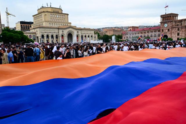 Supporters of Strong Armenia, the party of billionaire Russian-Armenian businessman Samvel Karapetyan - who is under house arrest on charges of plotting a coup, stage a campaign rally in central Yerevan on June 3, 2026, days ahead of the parliamentary elections. (Photo by Karen MINASYAN / AFP)