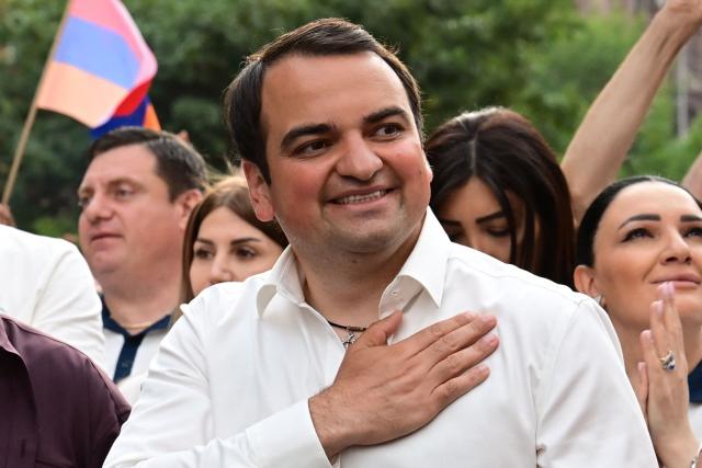 Supporters of Strong Armenia, the party of billionaire Russian-Armenian businessman Samvel Karapetyan - who is under house arrest on charges of plotting a coup, including his nephew Narek Karapetyan, stage a campaign march in Yerevan on June 3, 2026, days ahead of the parliamentary elections. (Photo by Karen MINASYAN / AFP)