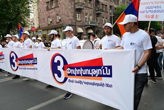 Supporters of Strong Armenia, the party of billionaire Russian-Armenian businessman Samvel Karapetyan - who is under house arrest on charges of plotting a coup, stage a campaign march in Yerevan on June 3, 2026, days ahead of the parliamentary elections. (Photo by Karen MINASYAN / AFP)