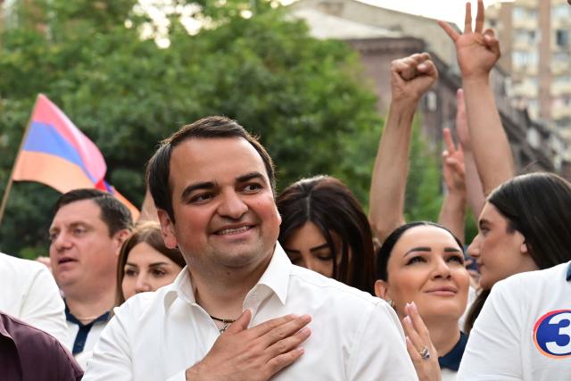 Supporters of Strong Armenia, the party of billionaire Russian-Armenian businessman Samvel Karapetyan - who is under house arrest on charges of plotting a coup, including his nephew Narek Karapetyan, stage a campaign march in Yerevan on June 3, 2026, days ahead of the parliamentary elections. (Photo by Karen MINASYAN / AFP)
