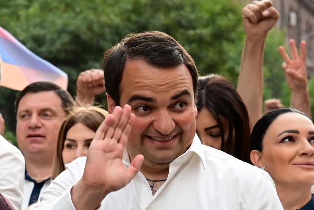 Supporters of Strong Armenia, the party of billionaire Russian-Armenian businessman Samvel Karapetyan - who is under house arrest on charges of plotting a coup, including his nephew Narek Karapetyan, stage a campaign march in Yerevan on June 3, 2026, days ahead of the parliamentary elections. (Photo by Karen MINASYAN / AFP)