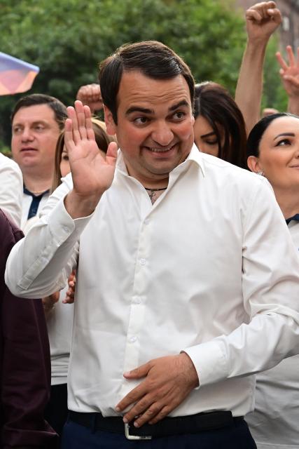 Supporters of Strong Armenia, the party of billionaire Russian-Armenian businessman Samvel Karapetyan - who is under house arrest on charges of plotting a coup, including his nephew Narek Karapetyan, stage a campaign march in Yerevan on June 3, 2026, days ahead of the parliamentary elections. (Photo by Karen MINASYAN / AFP)