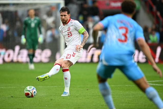 Denmark's midfielder #23 Pierre-Emile Hojbjerg passes the ball during the international friendly football match between Denmark and DR Congo ahead of the 2026 FIFA World Cup football tournament at the Stade Maurice Dufrasne in Liege on June 3, 2026. (Photo by NICOLAS TUCAT / AFP)