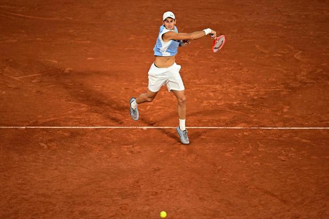 Italy's Matteo Arnaldi plays a forehand return to Italy's Matteo Berrettini during their men's quarter final singles match on day 11 of the French Open tennis tournament on Court Philippe-Chatrier at the Roland-Garros Complex in Paris on June 3, 2026. (Photo by JULIEN DE ROSA / AFP)