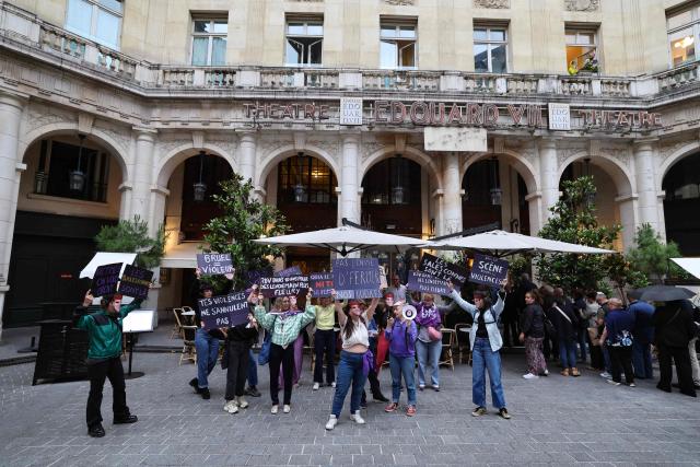 Members of the French feminist collective "NousToutes" (Us all) protest outside the Edouard VII theatre to express their anger at the impunity of alleged abusers and call for singer and actor Patrick Bruel to be withdrawn from all stage performances and demanding the complete cancellation of his tour, in Paris, on June 3, 2026. A performance of the play "Deuxieme Partie" was briefly disrupted on the evening of May 27, 2026 in Paris by activists from the feminist collective Nous Toutes who had taken their seats in the Theatre Edouard VII, according to videos posted on social media. Patrick Bruel is currently facing four rape allegations in France and a judicial investigation into sexual assault in Belgium. He denies all the allegations against him. (Photo by Xavier GALIANA / AFP)