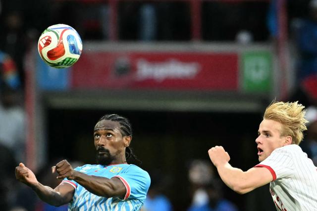Congo's midfielder #08 Samuel Moutoussamy (L) heads the ball as Denmark's midfielder #12 Victor Froholdt looks on during the international friendly football match between Denmark and DR Congo ahead of the 2026 FIFA World Cup football tournament at the Stade Maurice Dufrasne in Liege on June 3, 2026. (Photo by NICOLAS TUCAT / AFP)