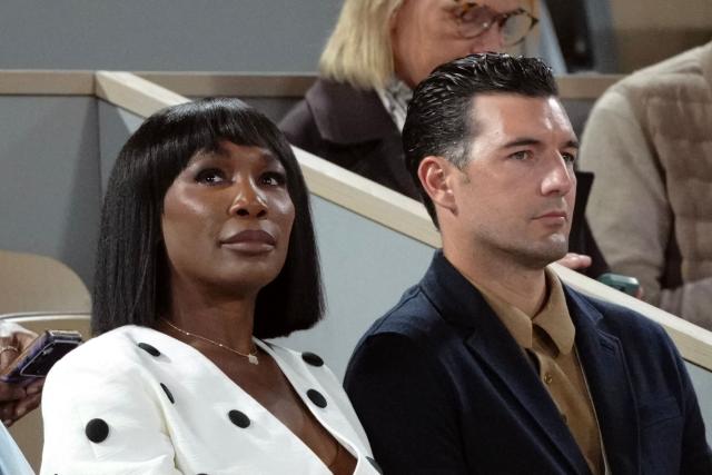 US tennis player Venus Williams (L) and her husband Italian-Danish actor and model Andrea Preti attend the men's quarter final singles between match Italy's Matteo Berrettini and Italy's Matteo Arnaldi on day 11 of the French Open tennis tournament on Court Philippe-Chatrier at the Roland-Garros Complex in Paris on June 3, 2026. (Photo by Dimitar DILKOFF / AFP)