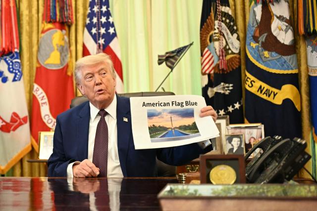 US President Donald Trump holds a picture of the Reflecting Pool on the National Mall as he speaks to the press in the Oval Office of the White House in Washington, DC, on June 3, 2026. (Photo by Mandel NGAN / AFP)