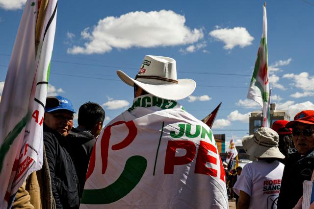 A supporter of Peru's presidential candidate for the Juntos por el Peru party, Roberto Sanchez, is seen during a meeting with members of the association of relatives of victims of the 2022-2023 protests against President Dina Boluarte, in Juliaca, Peru, on June 03, 2026. Peruvians will choose their president on June 7, 2026, between right-wing candidate Keiko Fujimori, heir to a political dynasty that divides the nation, and left-wing candidate Roberto Sáncheztwo diametrically opposed visions for a country plagued by instability and crime. (Photo by Juan Carlos CISNEROS / AFP)