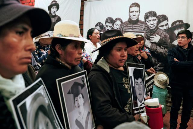 Members of the association of relatives of victims of the 2022-2023 protests against President Dina Boluarte, are seen during a meeting with Peru's presidential candidate for the Juntos por el Peru party, Roberto Sanchez, in Juliaca, Peru, on June 03, 2026. Peruvians will choose their president on June 7, 2026, between right-wing candidate Keiko Fujimori, heir to a political dynasty that divides the nation, and left-wing candidate Roberto Sáncheztwo diametrically opposed visions for a country plagued by instability and crime. (Photo by Juan Carlos CISNEROS / AFP)