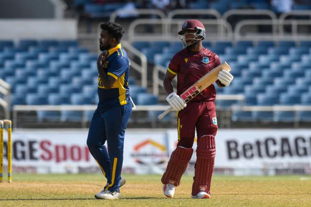 Shai Hope (R) of West Indies watches as his shot off Asitha Fernando (L) of Sri Lanka reaches the boundary during the first One Day International (ODI) cricket match between West Indies and Sri Lanka at Sabina Park in Kingston, Jamaica, on June 3, 2026. (Photo by Randy Brooks / AFP)
