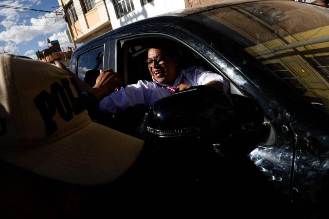 Peru's presidential candidate for the Juntos por el Peru party, Roberto Sanchez, greets supporters as he arrives at a campaign rally in Juliaca, Peru on June 3, 2026. Right-wing candidate Keiko Fujimori and leftist Roberto Sanchez will face off in Peru's presidential runoff on June 7, 2026. (Photo by Juan Carlos CISNEROS / AFP)