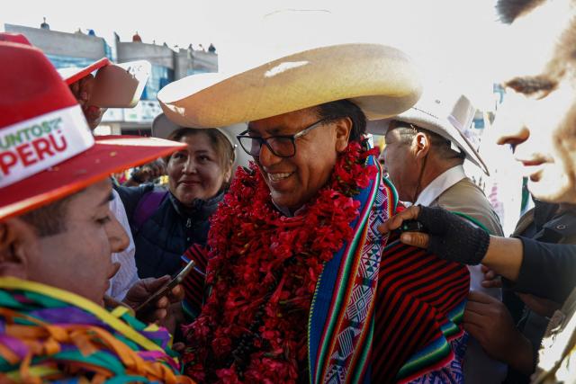 Peru's presidential candidate for the Juntos por el Peru party, Roberto Sanchez, greets supporters during a campaign rally in Juliaca, Peru on June 3, 2026. Right-wing candidate Keiko Fujimori and leftist Roberto Sanchez will face off in Peru's presidential runoff on June 7, 2026. (Photo by Juan Carlos CISNEROS / AFP)
