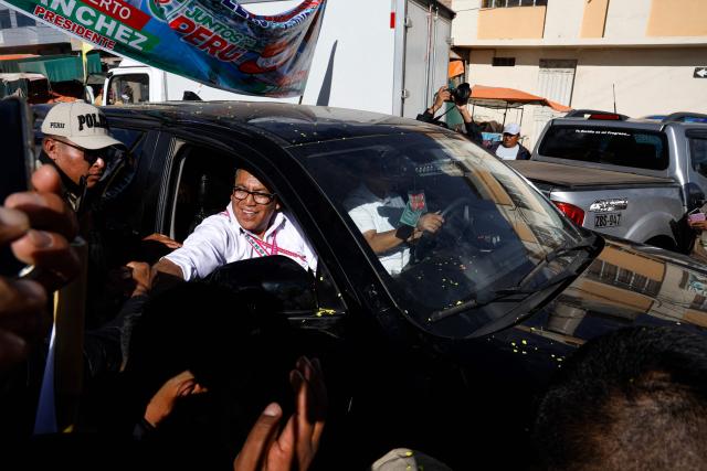 Peru's presidential candidate for the Juntos por el Peru party, Roberto Sanchez, greets supporters as he arrives at a campaign rally in Juliaca, Peru on June 3, 2026. Right-wing candidate Keiko Fujimori and leftist Roberto Sanchez will face off in Peru's presidential runoff on June 7, 2026. (Photo by Juan Carlos CISNEROS / AFP)