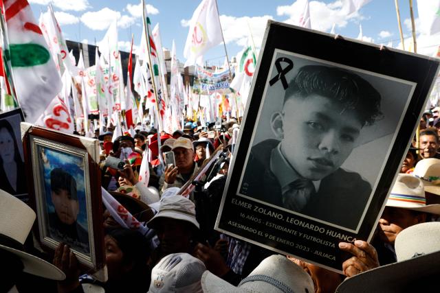 Supporters of Peru's presidential candidate for the Juntos por el Peru party, Roberto Sanchez, show portraits of deceased people during a campaign rally in Juliaca, Peru on June 3, 2026. Right-wing candidate Keiko Fujimori and leftist Roberto Sanchez will face off in Peru's presidential runoff on June 7, 2026. (Photo by Juan Carlos CISNEROS / AFP)