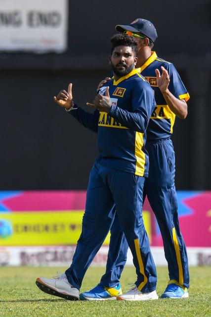 Sri Lanka bowler Wanindu Hasaranga (L) celebrates after trapping LBW West Indies batsman Sherfane Rutherford for 5 runs during the first One Day International (ODI) cricket match between West Indies and Sri Lanka at Sabina Park in Kingston, Jamaica, on June 3, 2026. (Photo by Randy Brooks / AFP)
