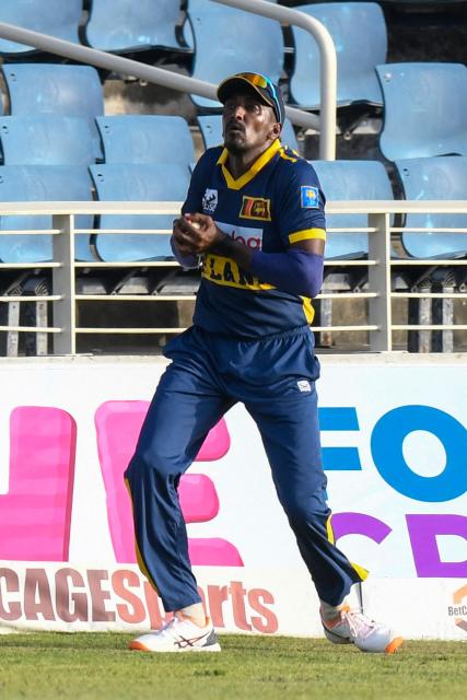 Sri Lanka's Milan Rathnayake takes the catch to dismiss West Indies batsman Gudakesh Motie for 22 runs during the first One Day International (ODI) cricket match between West Indies and Sri Lanka at Sabina Park in Kingston, Jamaica, on June 3, 2026. (Photo by Randy Brooks / AFP)