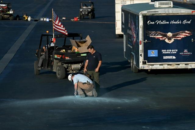 Contractors work on the Reflecting Pool at the National Mall in Washington, DC, on June 3, 2026. (Photo by Brendan SMIALOWSKI / AFP)