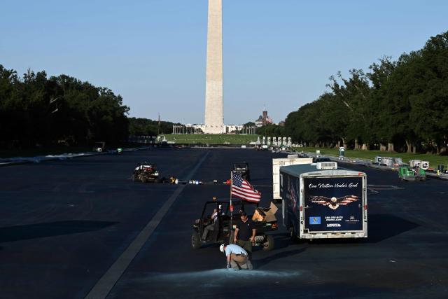 Contractors work on the Reflecting Pool at the National Mall in Washington, DC, on June 3, 2026. (Photo by Brendan SMIALOWSKI / AFP)