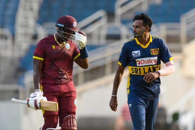 Matthew Forde (L) of West Indies walks off the field dismissed by Dushmantha Chameera (R) of Sri Lanka during the first One Day International (ODI) cricket match between West Indies and Sri Lanka at Sabina Park in Kingston, Jamaica, on June 3, 2026. (Photo by Randy Brooks / AFP)