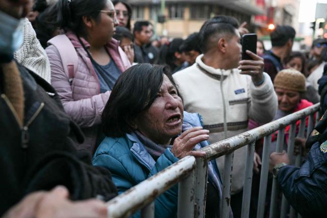 People stand in line to buy chicken amid food shortages caused by the blockades, in La Paz on June 3, 2026. Hundreds of demonstrators demanded on June 1, in Bolivia’s political capital the resignation of President Rodrigo Paz, as one month of protests and road blockades continues across the country with no solution to the crisis in sight. (Photo by Marvin RECINOS / AFP)