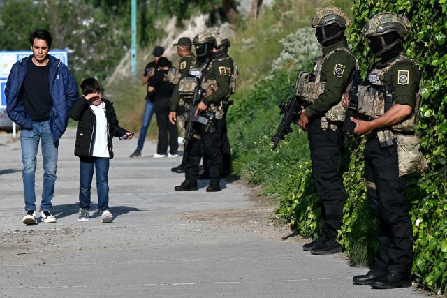 Mexican soldiers stand guard on a street in Pachuca, Mexico on June 3, 2026, ahead of the FIFA 2026 World Cup football tournament. (Photo by YURI CORTEZ / AFP)