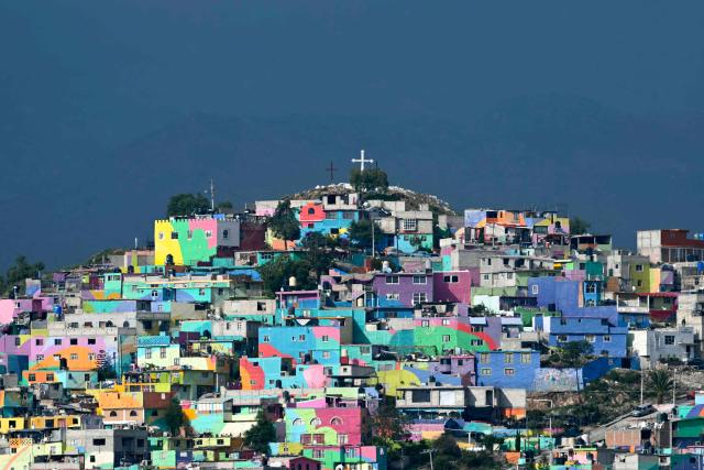 A view of the houses that make up the Macromural of Pachuca, Mexico on June 3, 2026. (Photo by YURI CORTEZ / AFP)
