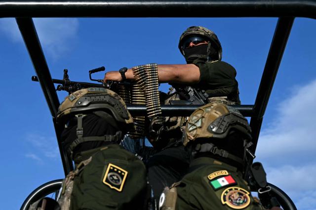 A Mexican soldier with a machine gun patrols on a street in Pachuca, Mexico on June 3, 2026, ahead of the FIFA 2026 World Cup football tournament. (Photo by YURI CORTEZ / AFP)