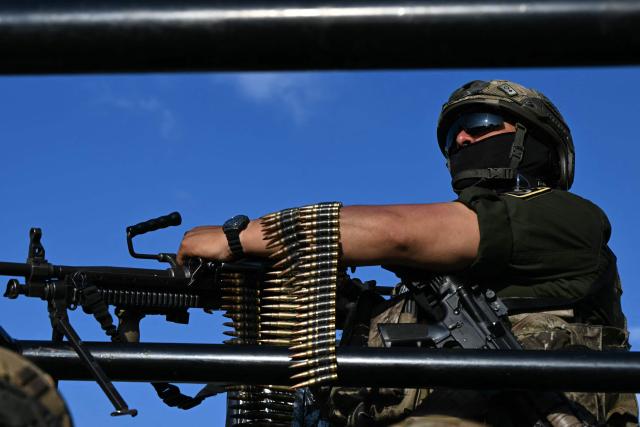 A Mexican soldier with a machine gun patrols on a street in Pachuca, Mexico on June 3, 2026, ahead of the FIFA 2026 World Cup football tournament. (Photo by YURI CORTEZ / AFP)
