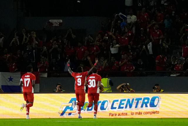 Panama's forward #09 Tomas Rodriguez celebrates with teammates after scoring his team's first goal during the international friendly football match between Panama and Dominican Republic at the Rommel Fernandez Gutierrez Stadium in Panama City on June 3, 2026. (Photo by ARNULFO FRANCO / AFP)
