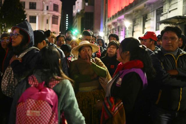 People protest over a lack of chicken amid food shortages caused by the blockades, in La Paz on June 3, 2026. Hundreds of demonstrators demanded on June 1, in Bolivia’s political capital the resignation of President Rodrigo Paz, as one month of protests and road blockades continues across the country with no solution to the crisis in sight. (Photo by Marvin RECINOS / AFP)