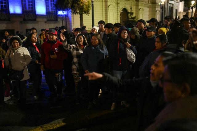 People protest over a lack of chicken amid food shortages caused by the blockades, in La Paz on June 3, 2026. Hundreds of demonstrators demanded on June 1, in Bolivia’s political capital the resignation of President Rodrigo Paz, as one month of protests and road blockades continues across the country with no solution to the crisis in sight. (Photo by Marvin RECINOS / AFP)