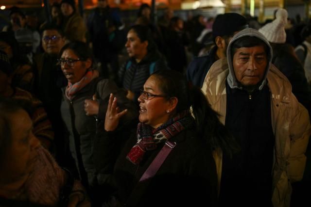 People protest over a lack of chicken amid food shortages caused by the blockades, in La Paz on June 3, 2026. Hundreds of demonstrators demanded on June 1, in Bolivia’s political capital the resignation of President Rodrigo Paz, as one month of protests and road blockades continues across the country with no solution to the crisis in sight. (Photo by Marvin RECINOS / AFP)