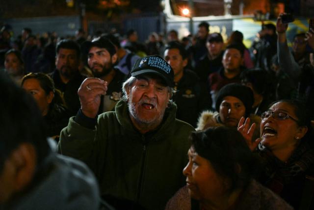 People protest over a lack of chicken amid food shortages caused by the blockades, in La Paz on June 3, 2026. Hundreds of demonstrators demanded on June 1, in Bolivia’s political capital the resignation of President Rodrigo Paz, as one month of protests and road blockades continues across the country with no solution to the crisis in sight. (Photo by Marvin RECINOS / AFP)