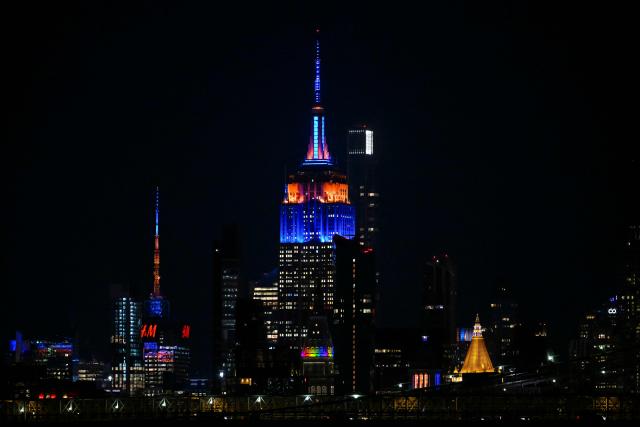 Manhattan buildings lit up in orange and blue seen during Game 1 of the NBA Finals between the New York Knicks and the San Antonio Spurs in New York, on June 3, 2026. (Photo by ANGELA WEISS / AFP)