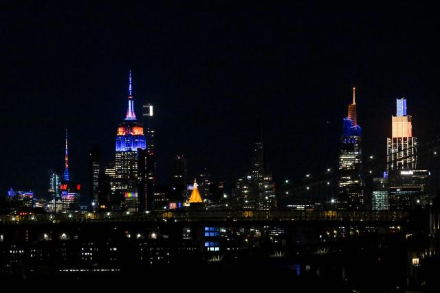 Manhattan buildings lit up in orange and blue seen during Game 1 of the NBA Finals between the New York Knicks and the San Antonio Spurs in New York, on June 3, 2026. (Photo by ANGELA WEISS / AFP)