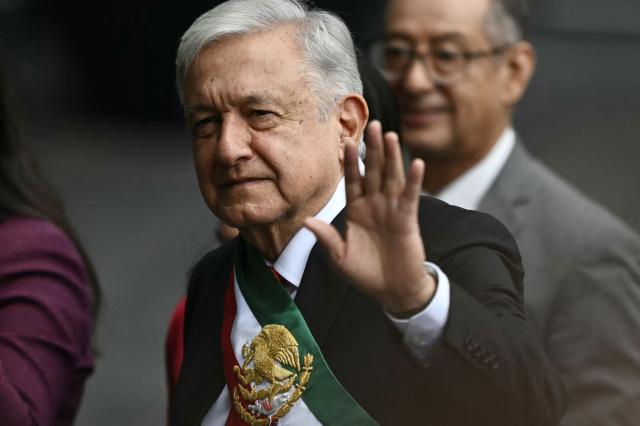 (FILES) Outgoing Mexican President Andres Manuel Lopez Obrador waves upon arrival at the inauguration ceremony of Mexico's President-elect Claudia Sheinbaum at the Congress of the Union in Mexico City on October 1, 2024. Former Mexican President Andres Manuel Lopez Obrador said on June 3, 2026, that US officials are trying to weaken the ruling party in order to strengthen the opposition, amid tensions between the two countries over drug trafficking allegations against a governor. (Photo by CARL DE SOUZA / AFP)