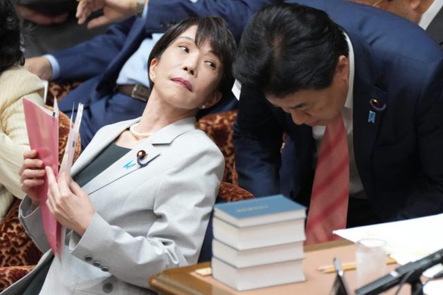 Japan's Prime Minister Sanae Takaichi (L) speaks with Chief Cabinet Secretary Kihara Minoru (R) during a House of Representatives budget committee session at the National Diet in Tokyo on June 4, 2026. (Photo by Kazuhiro NOGI / AFP)