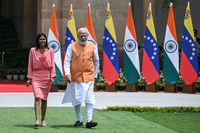 Venezuela's interim President Delcy Rodriguez (L) walks with India's Prime Minister Narendra Modi before their meeting at the Hyderabad House in New Delhi on June 4, 2026. (Photo by Arun SANKAR / AFP)