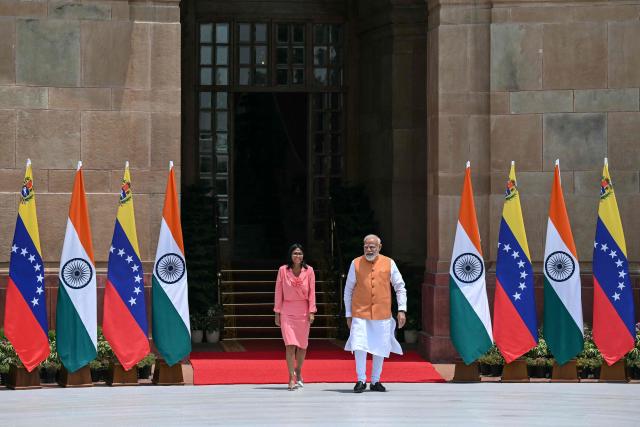Venezuela's interim President Delcy Rodriguez (L) walks with India's Prime Minister Narendra Modi before their meeting at the Hyderabad House in New Delhi on June 4, 2026. (Photo by Arun SANKAR / AFP)