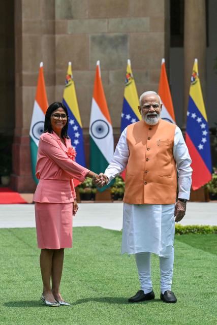 Venezuela's interim President Delcy Rodriguez (L) shakes hands with India's Prime Minister Narendra Modi before their meeting at the Hyderabad House in New Delhi on June 4, 2026. (Photo by Arun SANKAR / AFP)