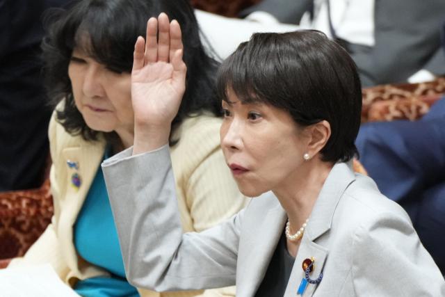 Japan's Prime Minister Sanae Takaichi raises her hand to answer a question during a House of Representatives budget committee session at the National Diet in Tokyo on June 4, 2026. (Photo by Kazuhiro NOGI / AFP)