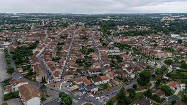 This aerial view shows the town of Fleurance on June 4, 2026 where searches are still ongoing to find 11-year-old Lyhanna who went missing on April 29 after getting into a man's car in front of her middle school in Fleurance, west of Toulouse. A 41 year-old suspect, father of one of Lyhanna's friends, who, prior to her disappearance, had been the subject of several reports and complaints, notably for the rape of a minor, was formally charged on June 1 with kidnapping and false imprisonment, and placed in custody. (Photo by Ed JONES / AFP)