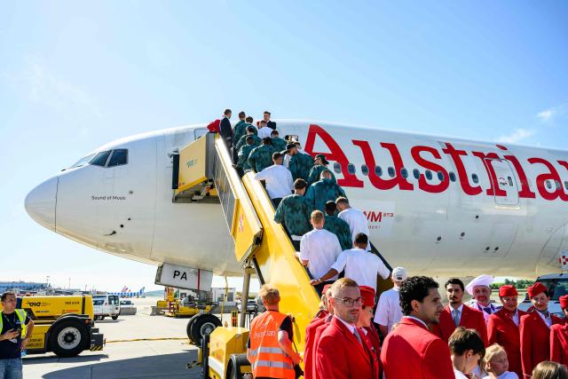 Members of Austria's national football team board a plane before departing from the Schwechat airport near Vienna, Austria, on June 4, 2026, ahead of the FIFA 2026 World Cup. (Photo by MAX SLOVENCIK / APA / AFP) / Austria OUT